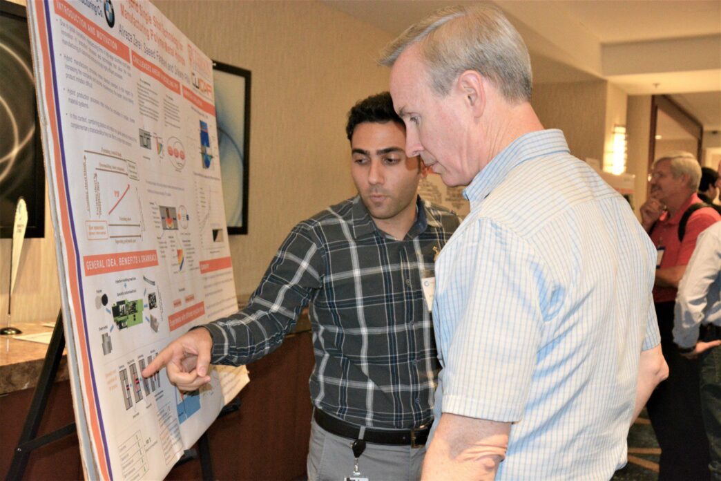 Alireza Zarei, a Ph.D. student, competes in a poster contest.