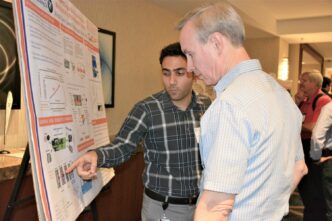 Alireza Zarei, a Ph.D. student, competes in a poster contest.