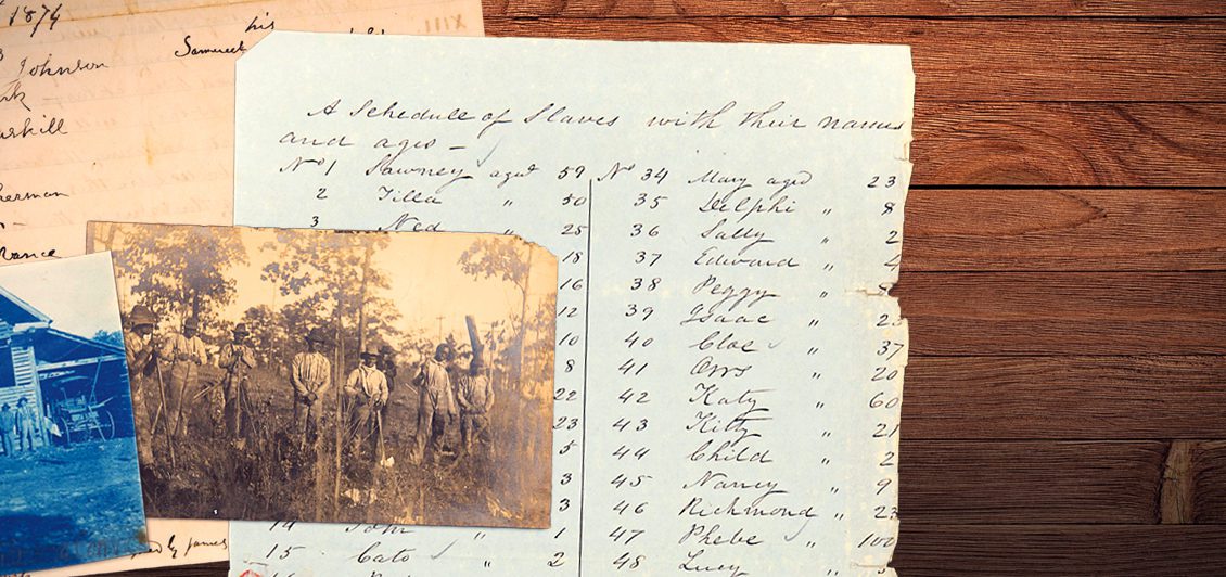 Historic documents and images are spread out on a table.