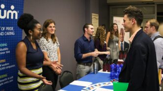 Recruiters at table with students