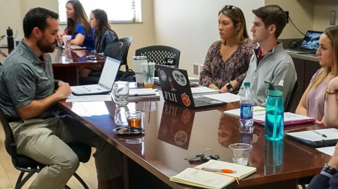 Kevin Chase works with sales students