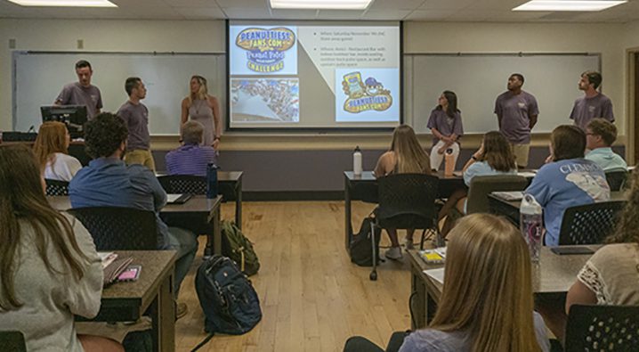 Students present projects in marketing promotional strategies class