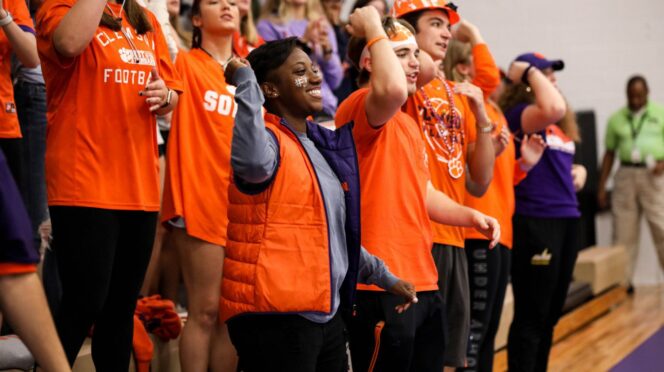 Melondy Munson, a Clemson senior, cheers during a 2019 home volleyball match with Central Spirit