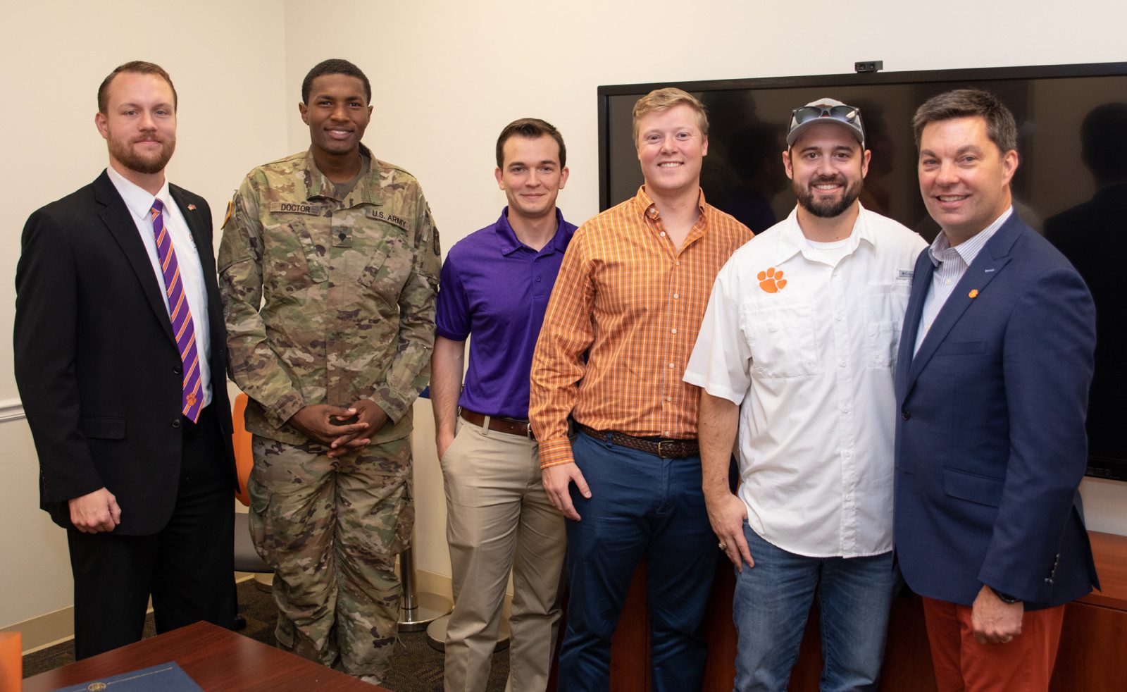 Photo of Brennan Beck (left), director of military and veteran engagement at Clemson, with Newport News Shipbuilding scholarship recipients Daquan Doctor, who serves in the Army National Guard; Damion Anderson, who served in the Marine Corps; Giff Finley, who served in the Coast Guard; and Stewart Fuller, who is on active duty with the Navy. At right is alumnus Matt Needy, who is the company’s vice president of operations.
