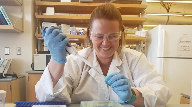 Heather Walters working in lab.