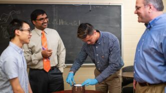 Joseph Singapogu (second from left) is leading the development of a simulator aimed at teaching future vascular surgeons how to suture blood vessels.
