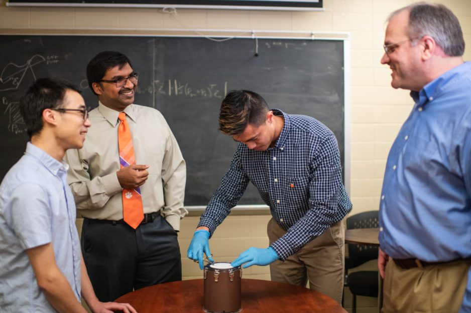 Joseph Singapogu (second from left) is leading the development of a simulator aimed at teaching future vascular surgeons how to suture blood vessels.
