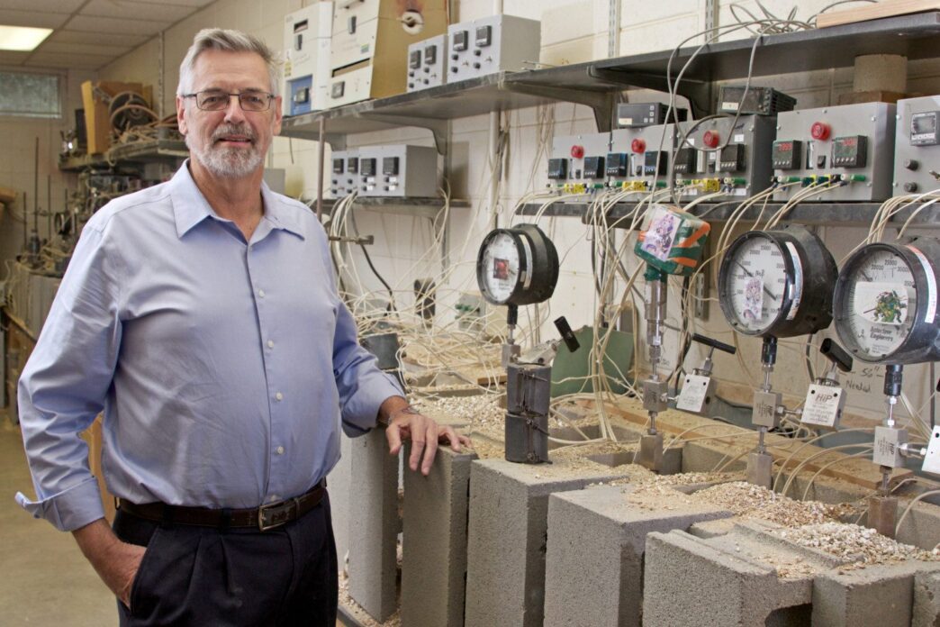 Chemistry professor Kolis standing in lab