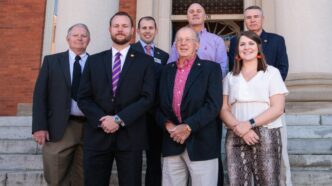 Contributors to the Veterans Alliance Fellowship gather on the steps of Sikes Hall in November 2019