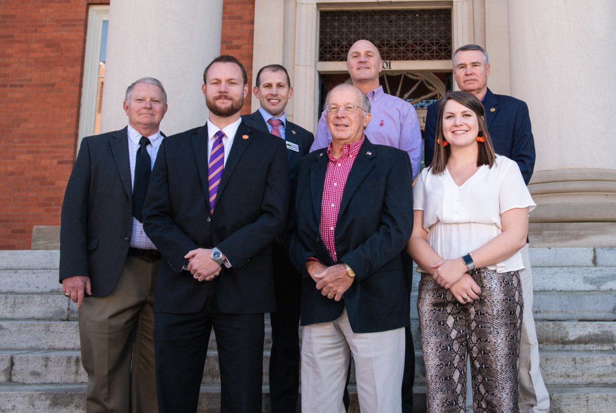 Contributors to the Veterans Alliance Fellowship gather on the steps of Sikes Hall in November 2019