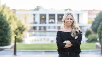 Madison Bolick, a construction science and management major from the class of 2020, in front of Cooper Library and the amphitheater.