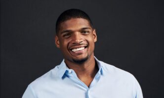 a man smiles at the camera