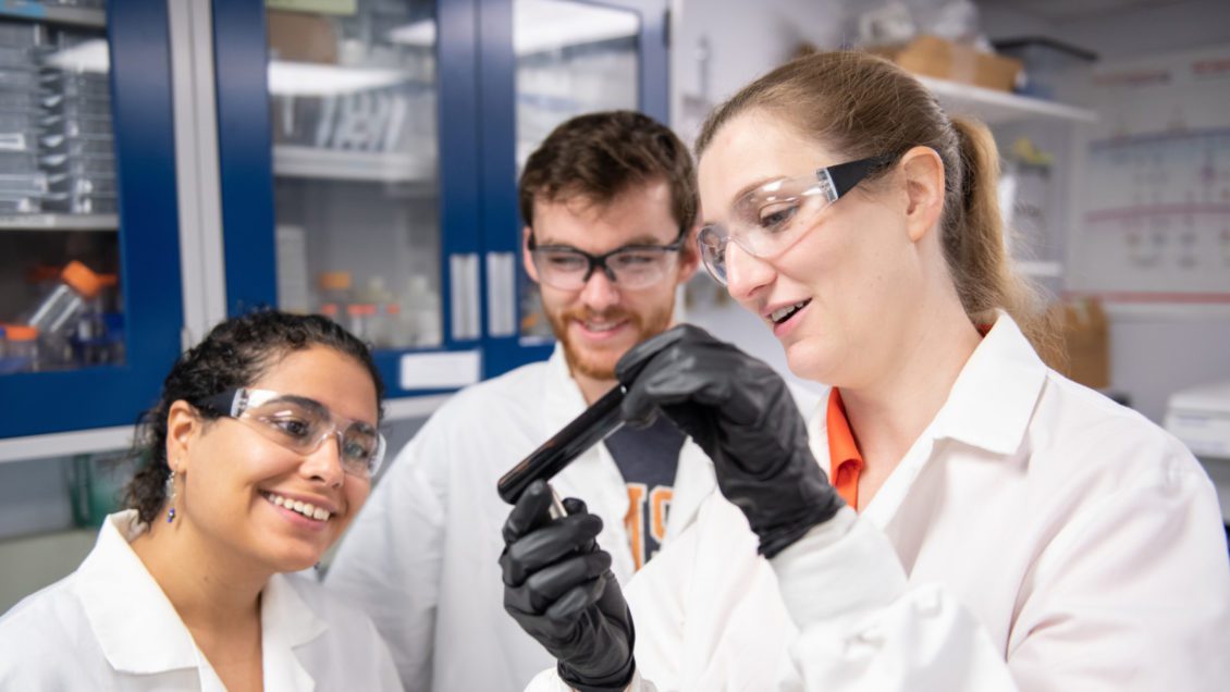 Delphine Dean (right) works with students in her Clemson University lab.
