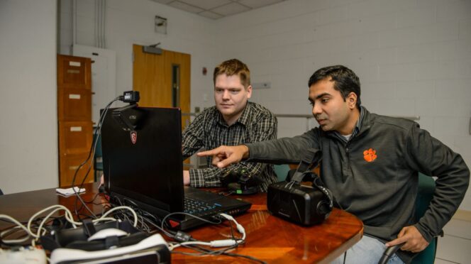 Kapil Chalil Madathil (left) works with Jeff Bertrand in their Clemson University lab, where they create virtual reality simulations to support workforce development.