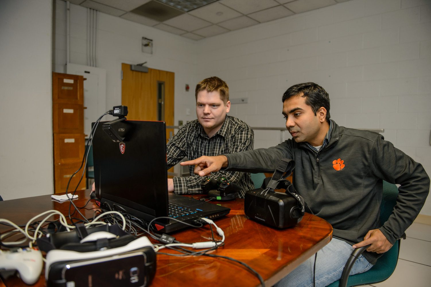 Kapil Chalil Madathil (left) works with Jeff Bertrand in their Clemson University lab, where they create virtual reality simulations to support workforce development.