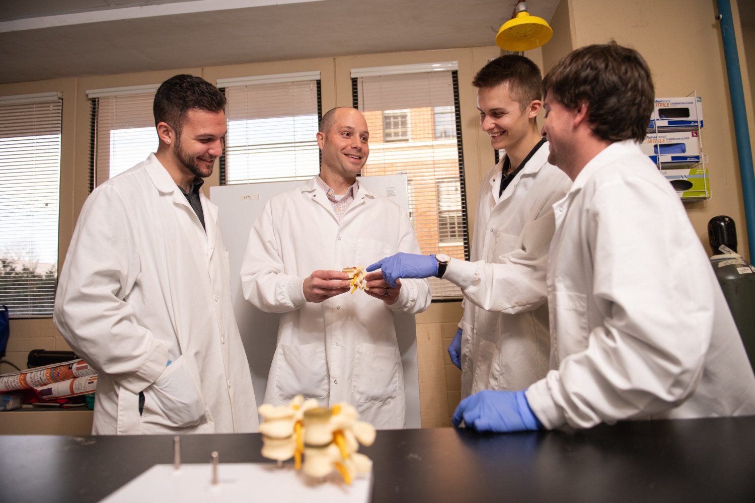 Jeremy Mercuri (second from left) works with students in his Clemson University lab.