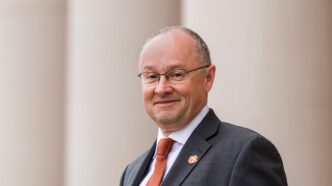 Headshot of man in suit