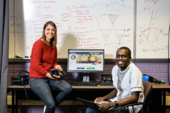 Samaneh Zamanifard (left) and Moses Namara talk in McAdams Hall.
