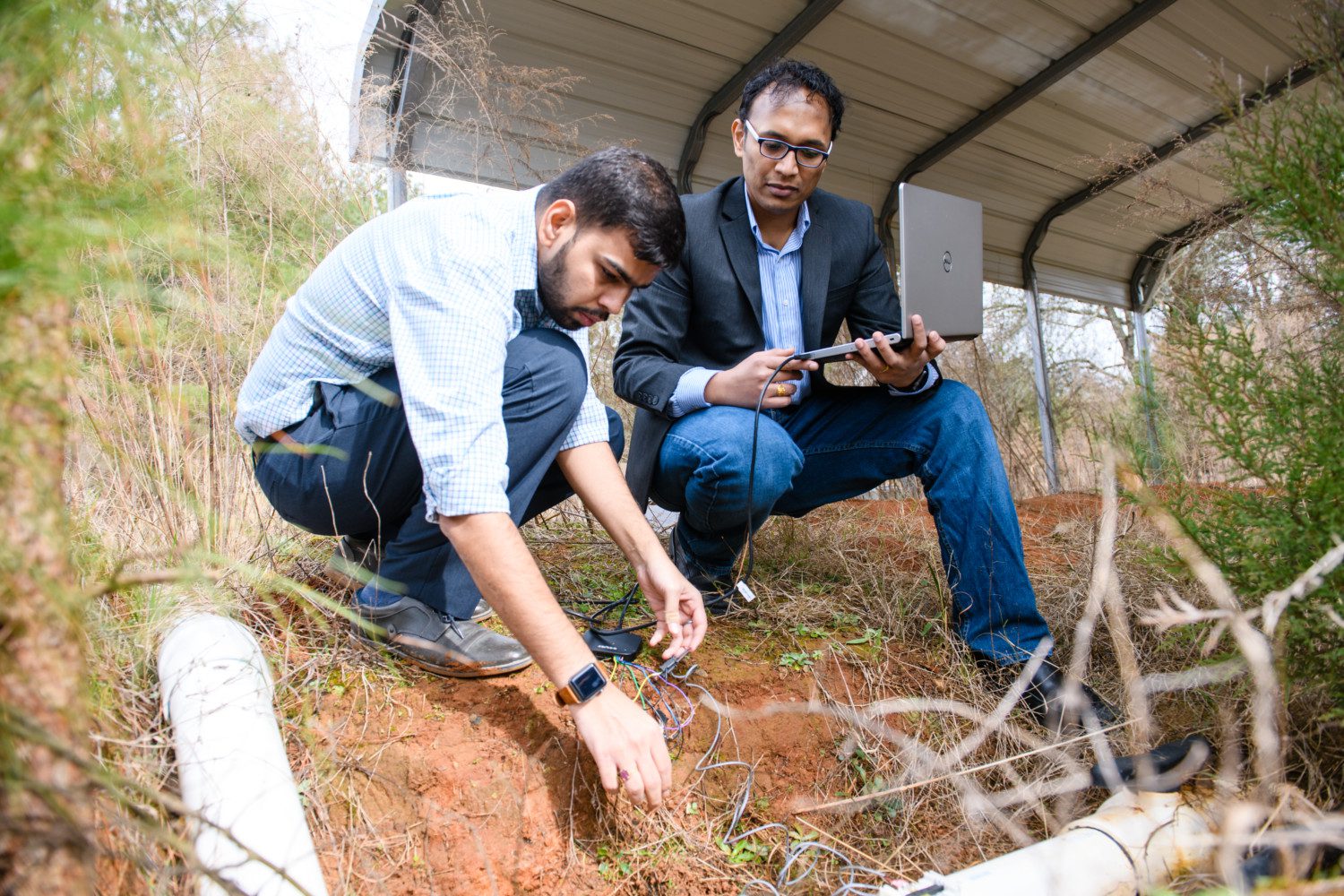 Kalyan Piratla (right) and Ph.D. student Harshit Shukla demonstrate their research at a facility off Hugo Drive about a mile from Clemson University's main campus.
