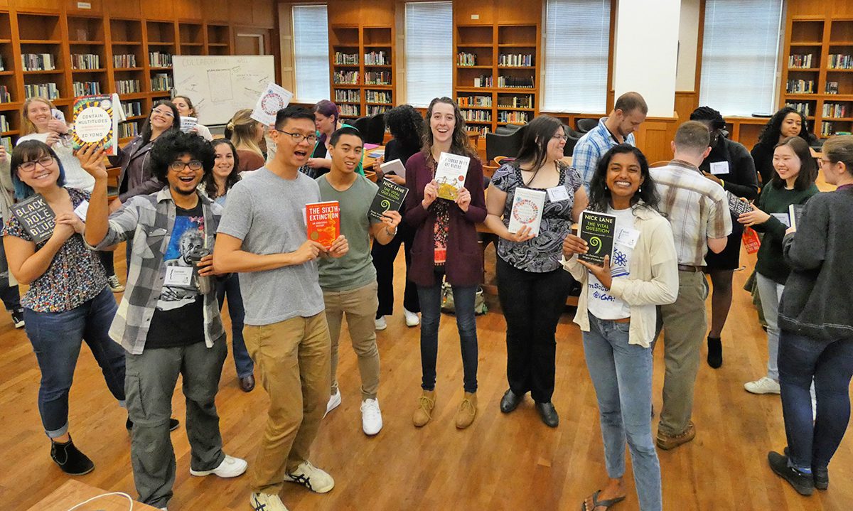 Rebecca MacPherson and other students holding books