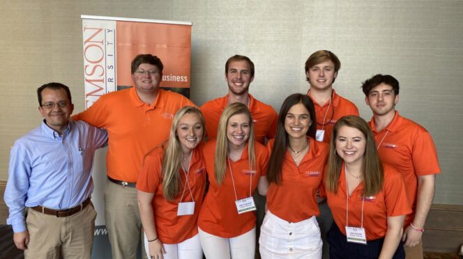 Advisor Michael Vassalos (left) with the winning Clemson Agribusiness team