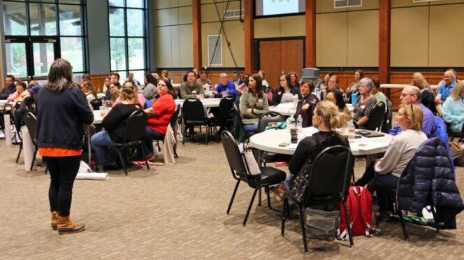 4-H agent addresses teachers during workshop.