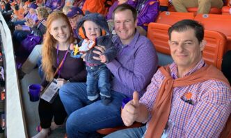 Lagasse family sitting at football game with Garcia