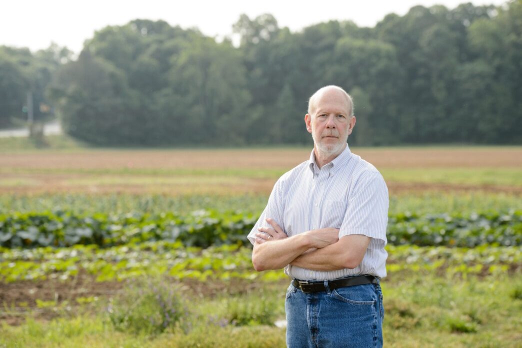 Stephen Kresovich stands in field.