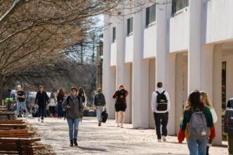 Students walk across Clemson University's campus in January 2020