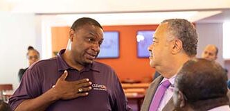 Reggie Hawthorne talks to Clemson Chief of Staff Max Allen.