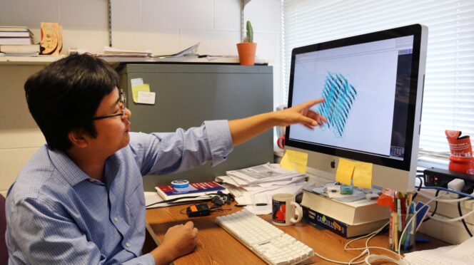 Feng Ding at his computer