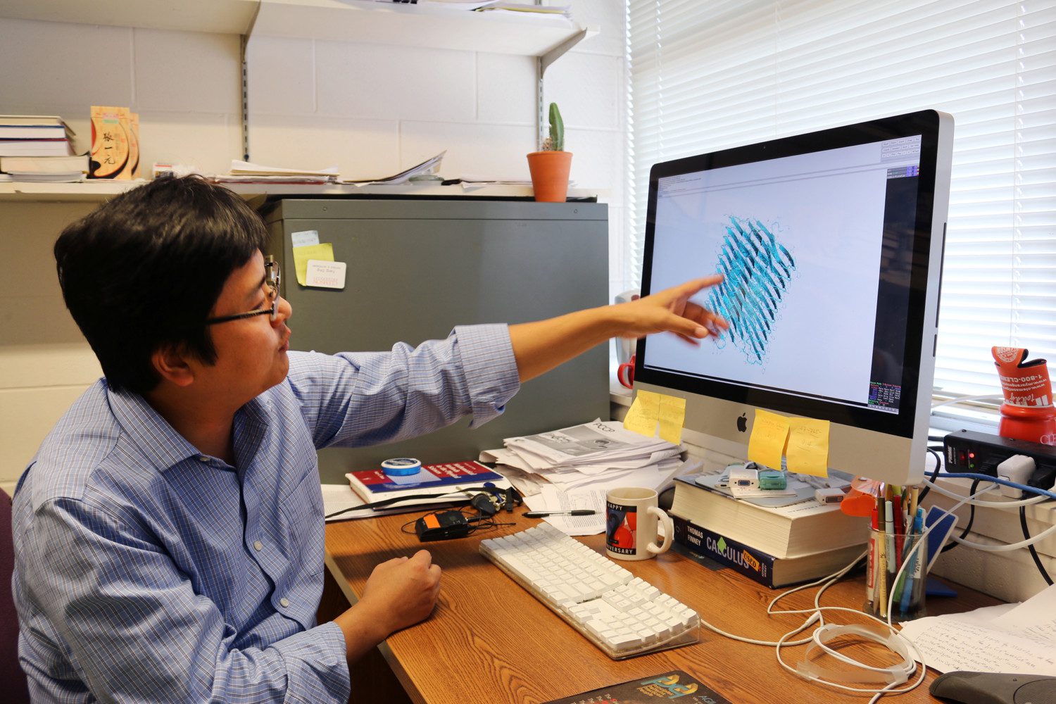Feng Ding at his computer