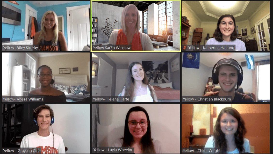 Zoom conference call screenshot of three rows of three photographs, consisting of eight students and professor in their own environments