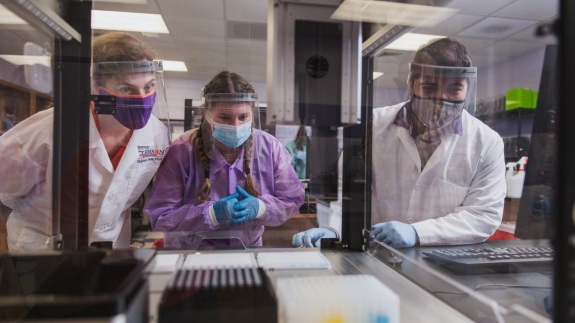 Researchers work in the new COVID-19 Clinical Diagnostics Lab. They are (from left): Delphine Dean, the Ron and Jane Lindsay Professor of Bioengineering, master's bioengineering student Erica Justice; and Mark Blenner, the McQueen Quattlebaum Associate Professor of Chemical Engineering.