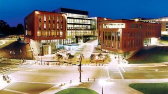 Exterior shot of Wilbur O. and Ann Powers College of Business at dusk