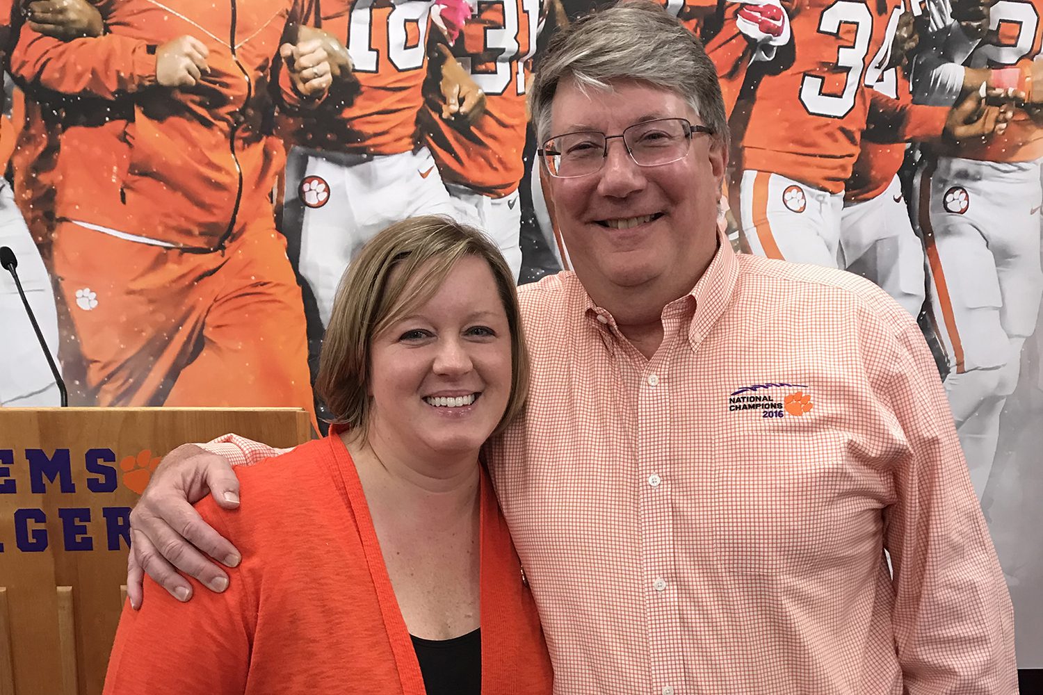 Libby Kehn with longtime sports information director Tim Bourret at his retirement party in 2018