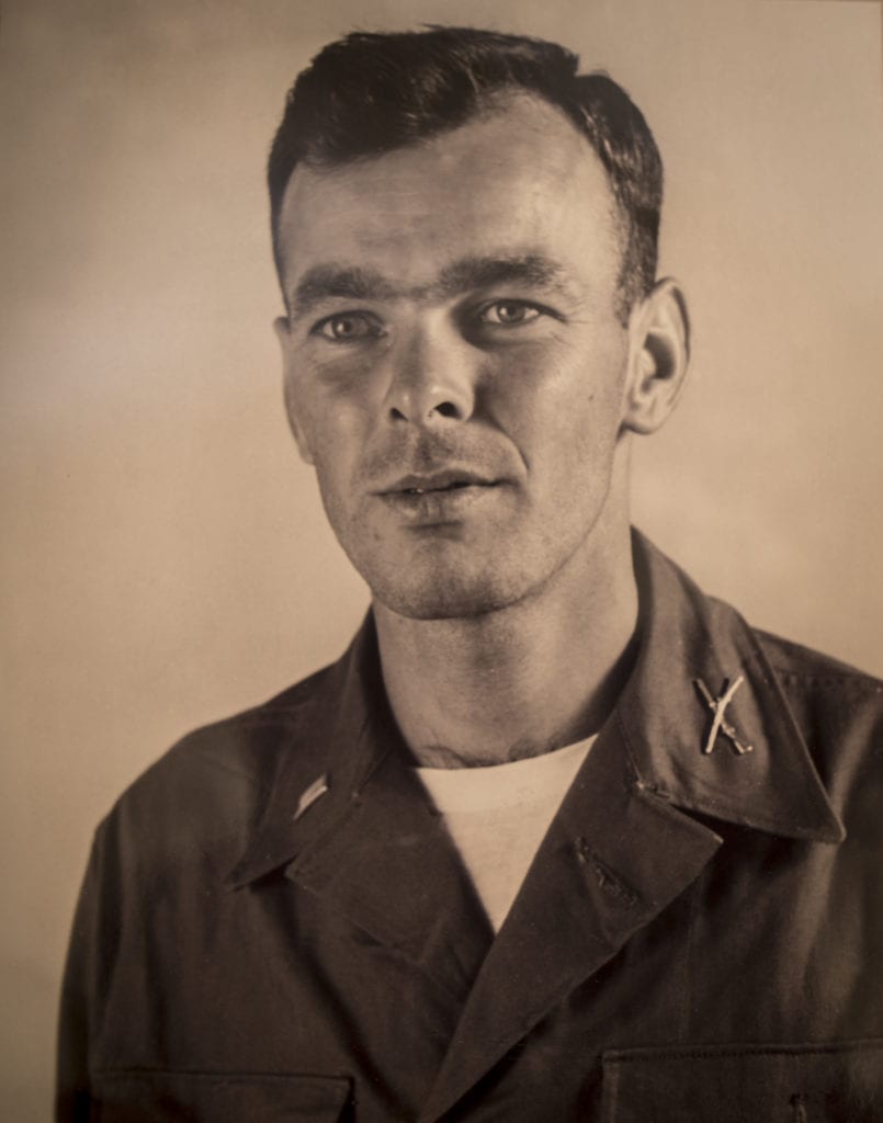 A black and white photo of a young Bill Funchess in uniform