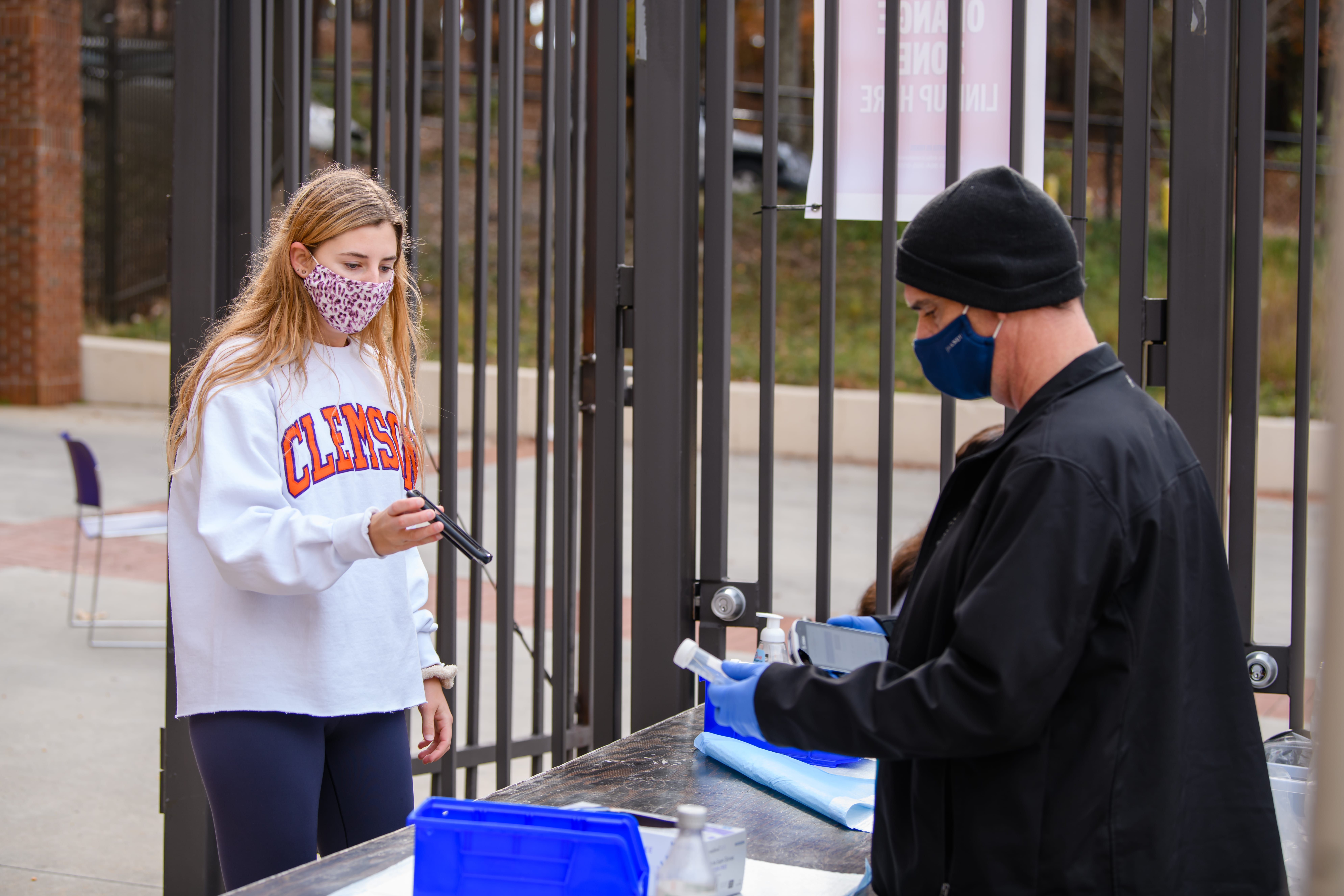 A student participates in COVID-19 testing at Memorial Stadium