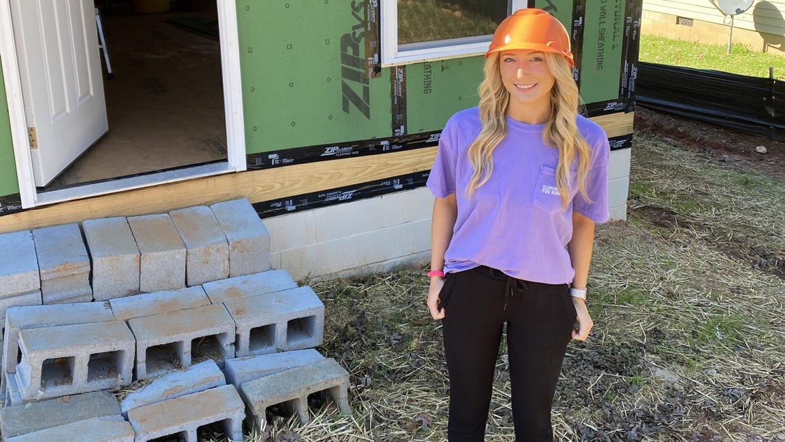 Caleigh Hankins, Clemson sophomore, in front of the Habitat for Humanity house build in Fall 2020