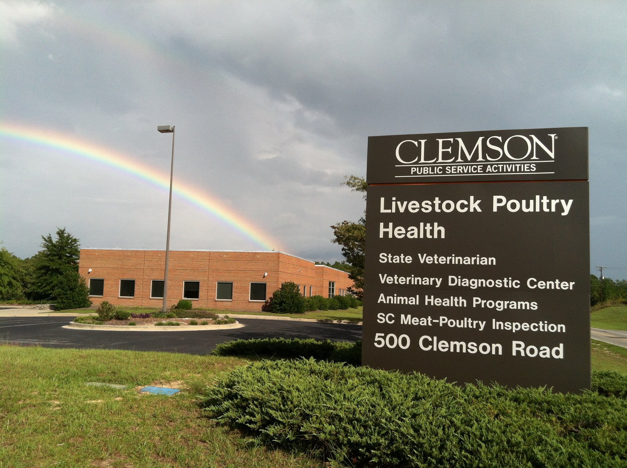 Livestock-Poultry Health Building and sign with rainbow