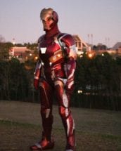 Emily Yarid poses in one of the Iron Man suits she made while a student at Clemson University with Memorial Stadium in the background.