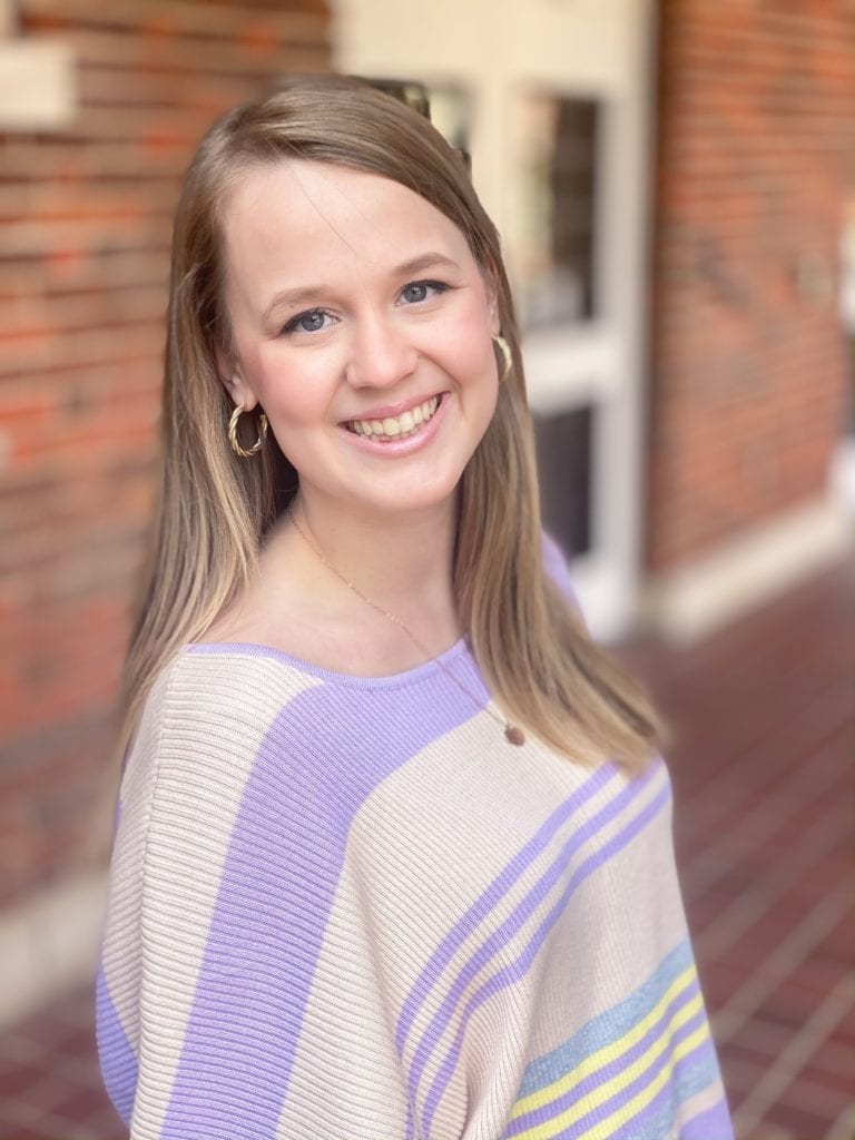 Clemson Student with brick wall behind her