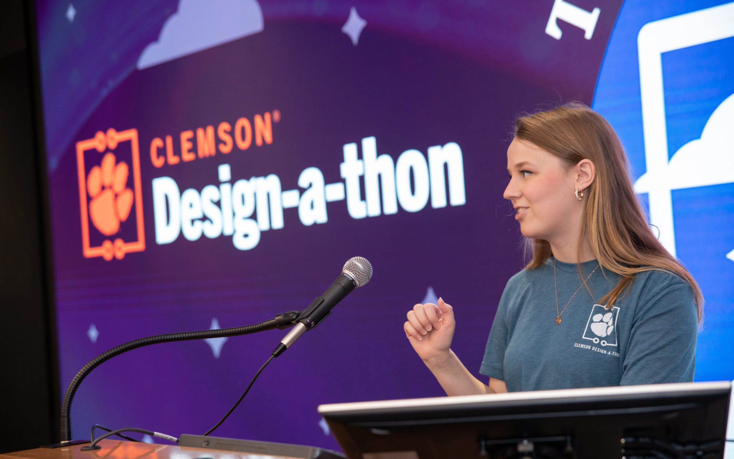 Clemson student at the Design-a-thon at the podium speaking.