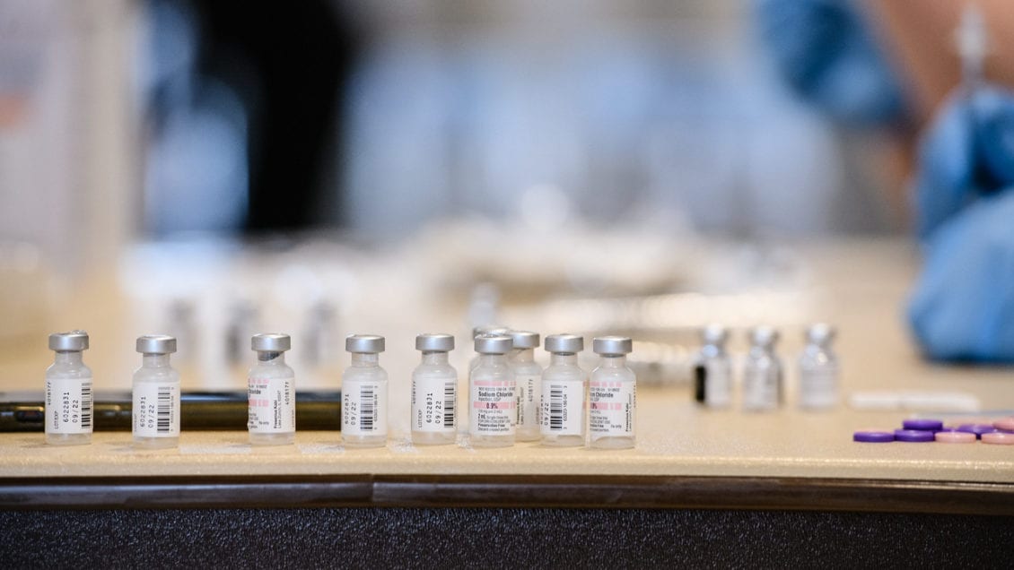 image of small bottles with covid vaccine