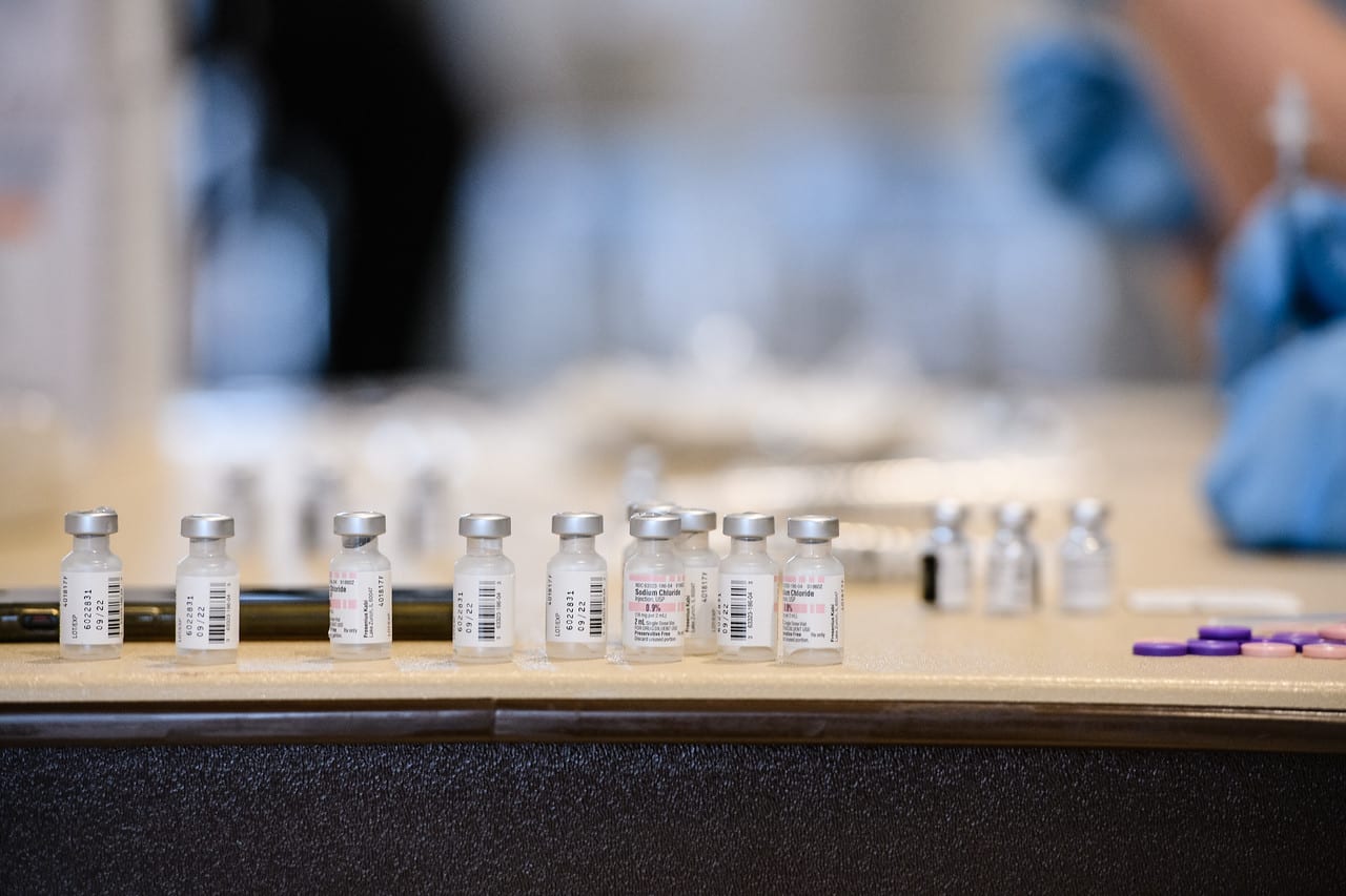 image of small bottles with covid vaccine