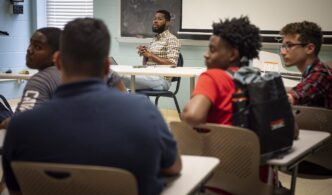 Matthew Kirk, associate director of Tiger Alliance, speaks to a class of rising high school sophomores, June 19, 2019