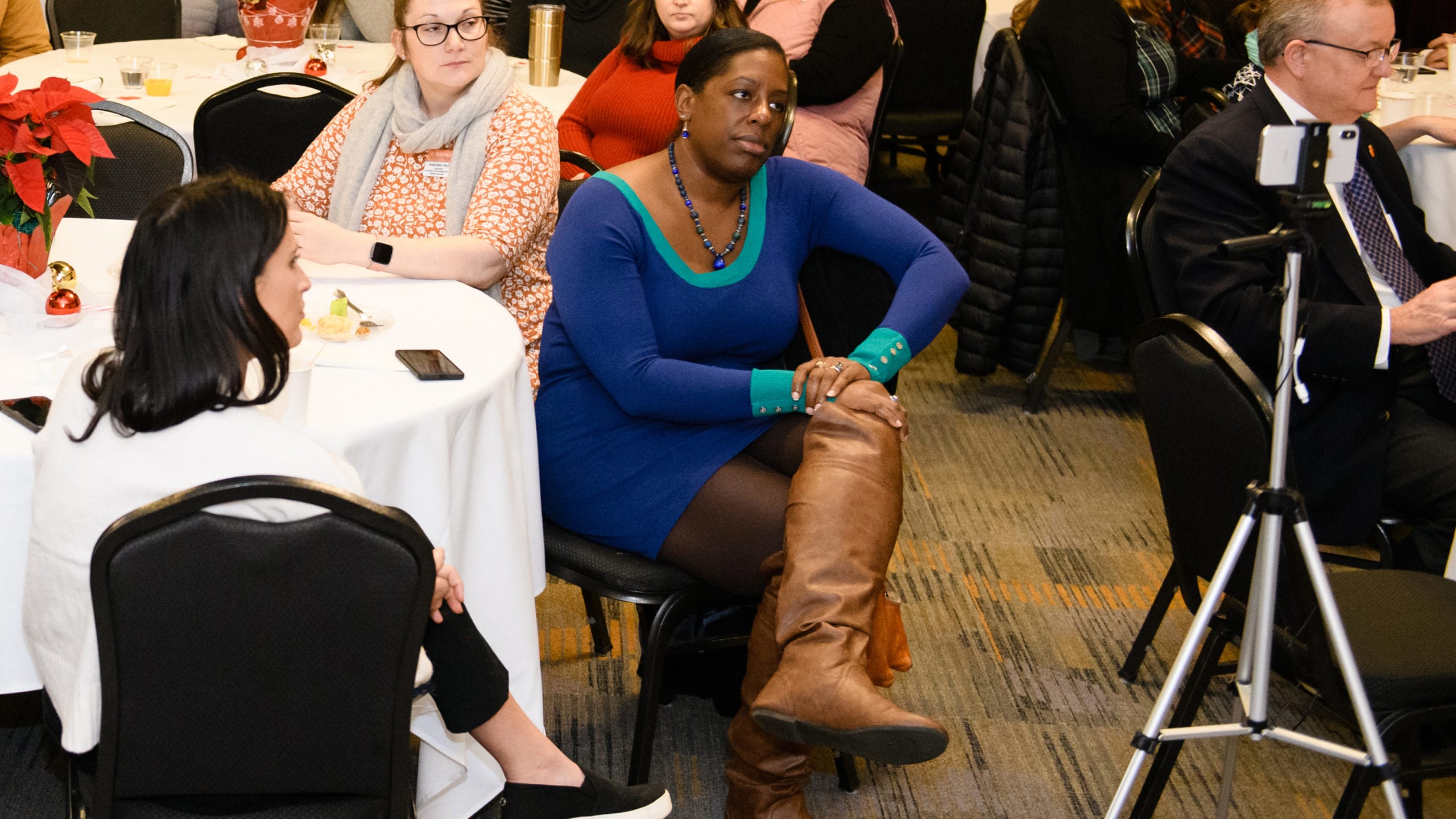 Birma Gainor, interim director of Counseling and Psychological Services (CAPS), listens during a 2019 Student Affairs Winter Social