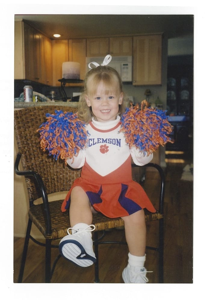 Student, Ashley Babinchak, as a young child in a Clemson cheerleader outfit