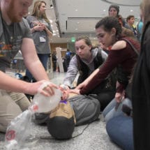 Students performing CPR during an innovation festival.