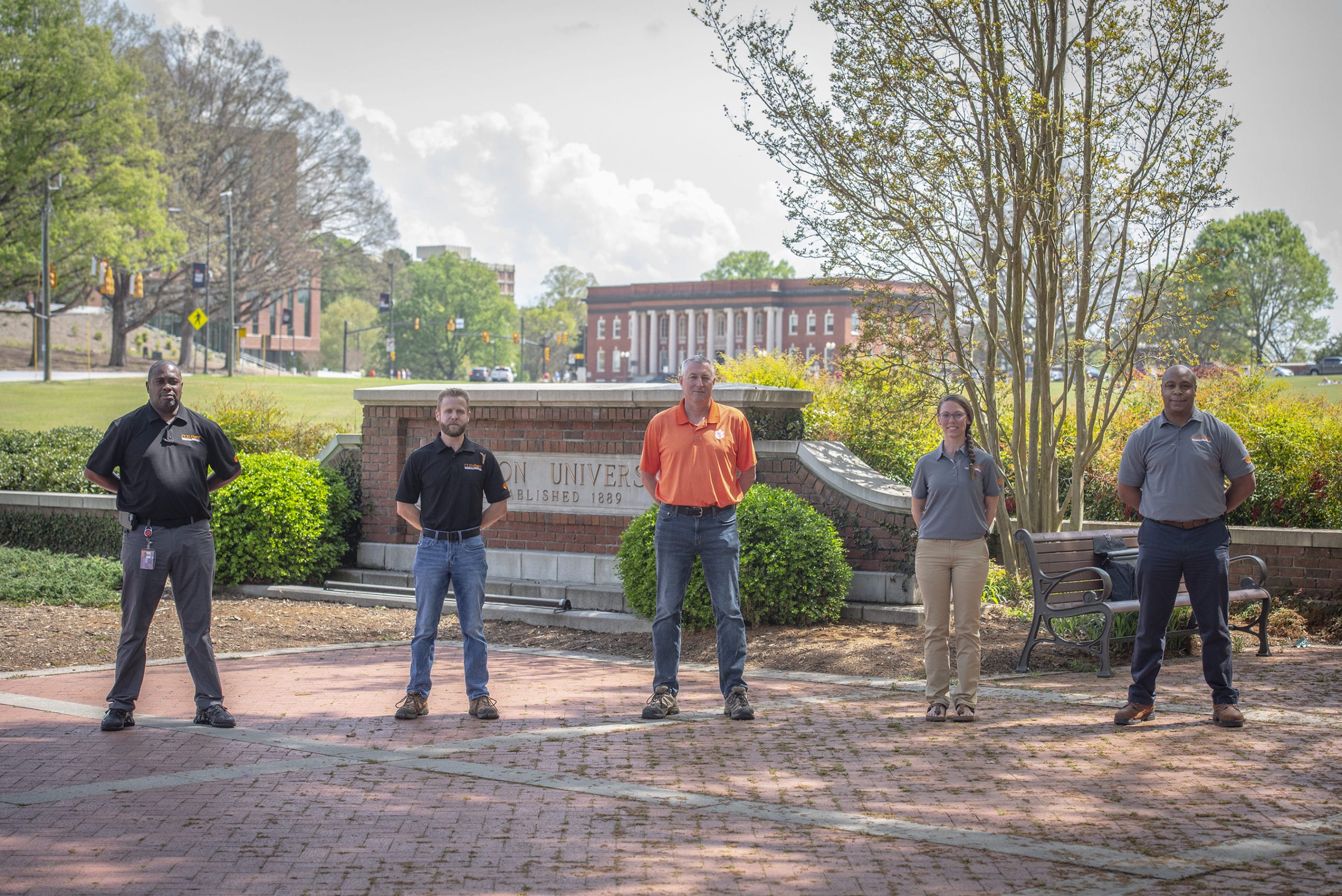 Members of the Environmental and Safety team standing and entrance to Clemson